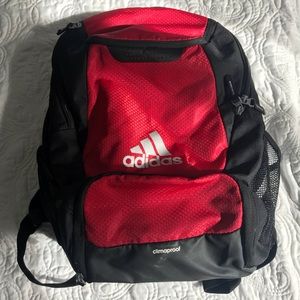 A red Adidas soccer backpack